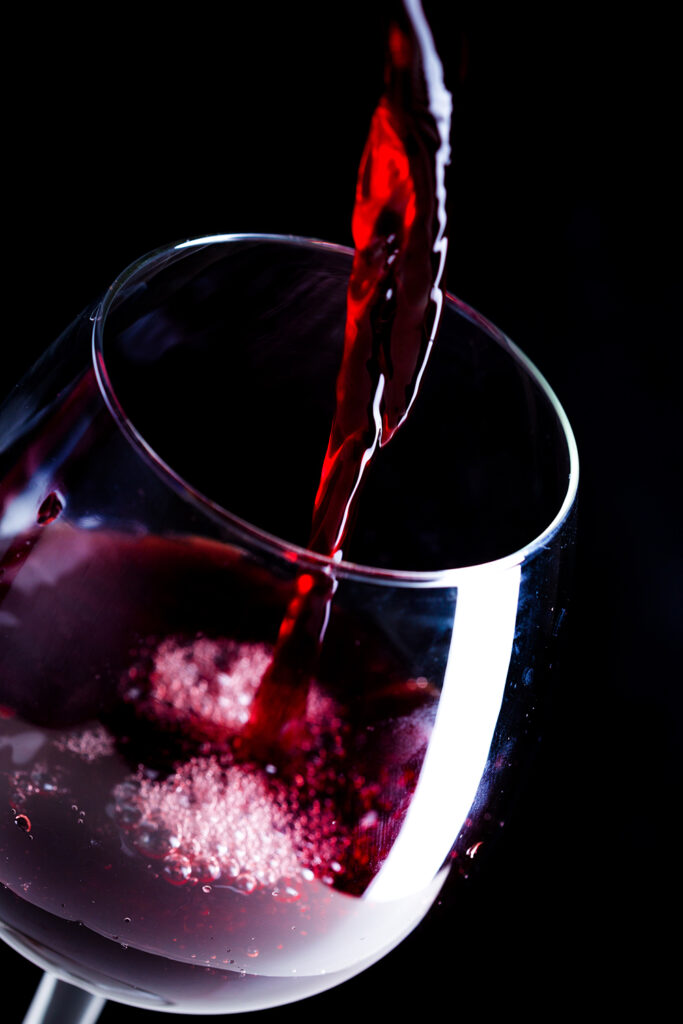 pouring-red-wine-into-the-glass